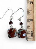 Making Waves Jewelry and Accessories sterling silver drop earrings with square rhyolite and triangular garnet stones.