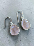 Making Waves Jewelry and Accessories faceted oval rose quartz drop earrings set in polished 925 sterling silver hooks.