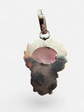 Back view of a Making Waves Jewelry and Accessories rose quartz pendant in oxidized sterling silver with filigree