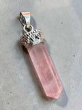 Making Waves Jewelry and Accessories rose quartz crystal point pendant with a vintage-inspired silver-tone metal cap.