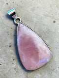 Making Waves Jewelry and Accessories teardrop rose quartz pendant in a polished sterling silver bezel setting.