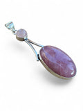 Making Waves Jewelry and Accessories rose quartz pendant featuring an oval and round stone set in polished sterling silver