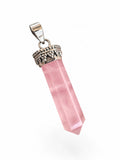 Making Waves Jewelry and Accessories rose quartz crystal point pendant with a silver beaded cap on a white background.