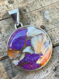 Making Waves Jewelry and Accessories round pendant featuring purple copper turquoise and spiny oyster in sterling silver