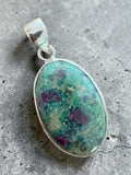 Making Waves Jewelry and Accessories oval ruby in fuchsite pendant set in polished 925 sterling silver