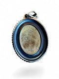 Making Waves Jewelry and Accessories oval rutilated quartz pendant in a vintage-style oxidized sterling silver setting.