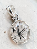 Making Waves Jewelry and Accessories oval rutilated quartz pendant with black tourmaline needles in sterling silver bezel