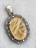 Making Waves Jewelry and Accessories oval rutilated quartz pendant with a beaded sterling silver setting