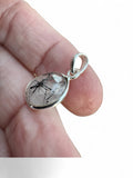 Making Waves Jewelry and Accessories oval rutilated quartz pendant with black tourmaline inclusions in sterling silver