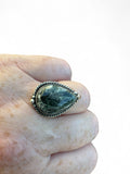 Making Waves Jewelry and Accessories teardrop Seraphinite ring in sterling silver with a twisted rope border.