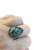 Making Waves Jewelry and Accessories teardrop Seraphinite ring in sterling silver with twisted rope border on a finger