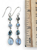 Making Waves Jewelry and Accessories sterling silver drop earrings with moonstone and blue topaz stones next to a ruler
