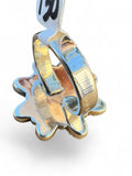 Making Waves Jewelry and Accessories floral statement ring showing the polished sterling silver band and back setting