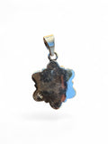 Back view of a Making Waves Jewelry and Accessories sterling silver flower pendant showing the 925 hallmark stamp.