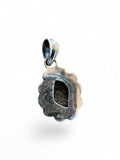 Making Waves Jewelry and Accessories sterling silver pendant back view showing 925 hallmark and scalloped edge
