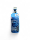 Back view of a Making Waves Jewelry and Accessories sterling silver pendant showing the 925 hallmark stamp.