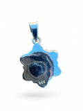 Back view of a Making Waves Jewelry and Accessories floral pendant showing the 925 sterling silver hallmark stamp.