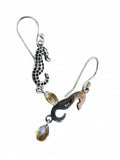 Making Waves Jewelry and Accessories silver seahorse drop earrings with dark accents and yellow crystal charms.