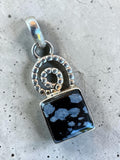 Making Waves Jewelry and Accessories snowflake obsidian pendant with a sterling silver spiral and beaded detail.