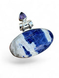 Making Waves Jewelry and Accessories oval sodalite and amethyst pendant in a sterling silver bezel setting.