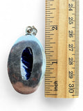 Making Waves Jewelry and Accessories oval sodalite pendant in sterling silver bezel with ruler for scale