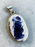 Making Waves Jewelry and Accessories oval sodalite pendant in a sterling silver beaded bezel setting