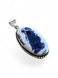 Making Waves Jewelry and Accessories oval sodalite pendant in a sterling silver beaded bezel setting
