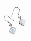 Making Waves Jewelry and Accessories square moonstone dangle earrings in polished 925 sterling silver with hook backs.
