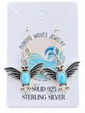 Making Waves Jewelry and Accessories sterling silver bat dangle earrings with oval blue Larimar cabochon stones.