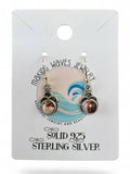Making Waves Jewelry and Accessories sterling silver dangle earrings with burgundy and white stone inlay on display.