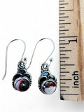 Making Waves Jewelry and Accessories sterling silver dangle earrings with burgundy and white stone inlay and beadwork.