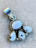 Making Waves Jewelry and Accessories sterling silver pendant featuring a cluster of white stone cabochons with rope trim