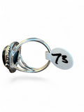 Making Waves Jewelry and Accessories sterling silver teardrop ring with a split-shank band and side view profile.