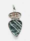 Making Waves Jewelry and Accessories sterling silver pendant with oval pink marbled stone and teardrop green stone.
