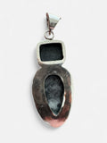 Making Waves Jewelry and Accessories artisan sterling silver pendant with black and white stone in a teardrop design.