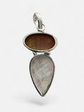 Making Waves Jewelry and Accessories sterling silver pendant featuring an oval sunstone and a teardrop moonstone.
