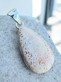 Making Waves Jewelry and Accessories teardrop sunstone pendant with geometric inclusions in a polished sterling silver bezel