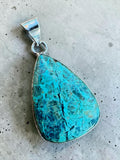 Making Waves Jewelry and Accessories teardrop pendant with a vibrant teal gemstone in a polished sterling silver bezel.
