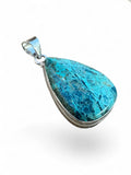 Making Waves Jewelry and Accessories teardrop pendant with a teal gemstone in a polished sterling silver bezel setting.