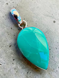 Making Waves Jewelry and Accessories teardrop pendant with a sea-foam green gemstone set in 925 sterling silver.