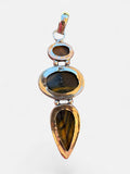 Making Waves Jewelry and Accessories triple stone pendant featuring Tiger's Eye gems set in polished 925 sterling silver
