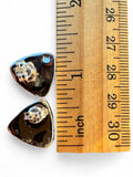Making Waves Jewelry and Accessories triangle turquoise stud earrings with sterling silver backs next to a ruler.