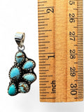 Making Waves Jewelry and Accessories sterling silver turquoise cluster pendant measured against a wooden ruler