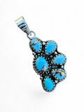 Making Waves Jewelry and Accessories turquoise cluster pendant in 925 sterling silver with artisan beadwork detail.