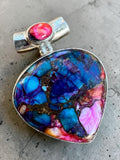 Making Waves Jewelry and Accessories heart-shaped pendant with multi-colored turquoise and sterling silver setting.
