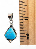 Making Waves Jewelry and Accessories turquoise teardrop pendant in sterling silver with rope detail next to a ruler