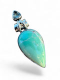 Making Waves Jewelry and Accessories teardrop turquoise pendant in 925 sterling silver with a blue gemstone accent.