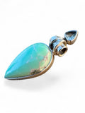 Making Waves Jewelry and Accessories teardrop turquoise pendant in sterling silver with a small blue gemstone accent