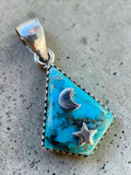 Making Waves Jewelry and Accessories turquoise pendant with silver moon and star accents in a serrated bezel setting.
