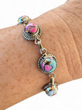 Making Waves Jewelry and Accessories artisan bracelet with multi-colored turquoise stones in twisted sterling silver